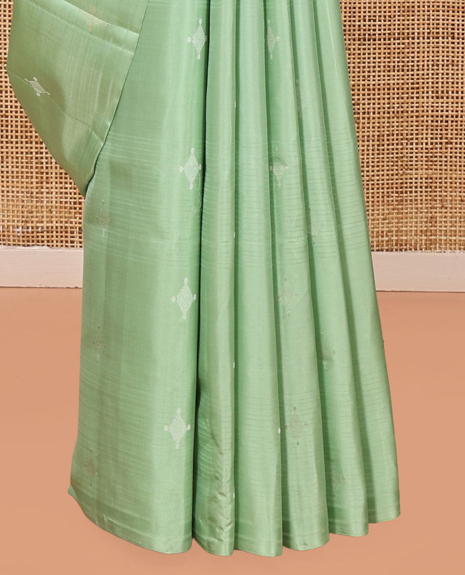 Borderless Green Mayuri Soft Silk Saree, Woven with Buttas All Over Its Body, Sparsely Sparkled Pallu, and Paired with a Matching Blouse