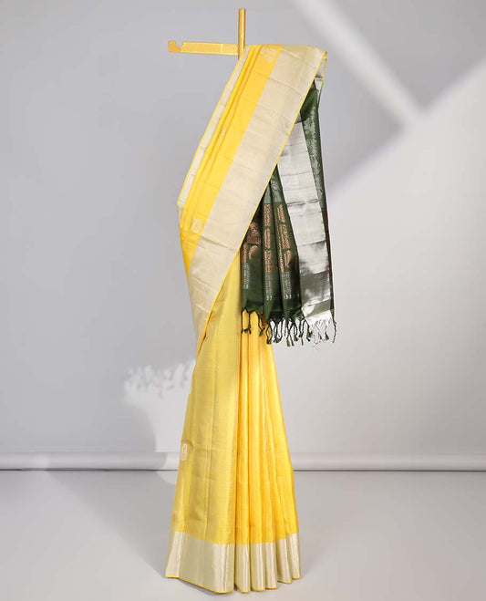 Yellow leaf buttas soft silk saree with contrast zari border & floral zari design pallu