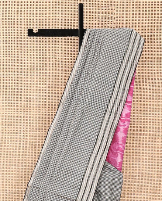 White and Black Mayuri Soft Silk Saree, Subtly Sparkled with Kasa-Kasa Checks All Over Its Body, Highlighted by Zari Striped Border, Delicately Woven Pallu of Ikkat Texture, and Paired with a Contrast Blouse