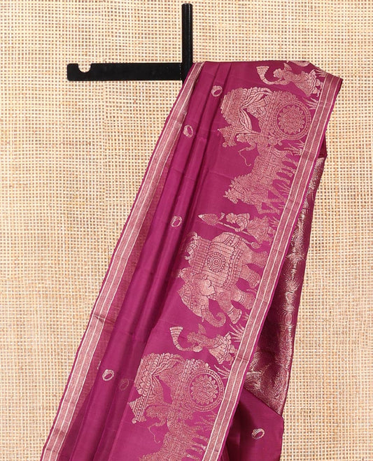 Purple Mayuri Soft Silk Saree, Richly Detailed with Ring Buttas All Over Its Body, Highlighted by a Zari Border of Wedding-Style Bride and Groom Motifs Weave, Sparsely Woven Pallu with Wedding-Related Motifs, and Paired with a Matching Blouse