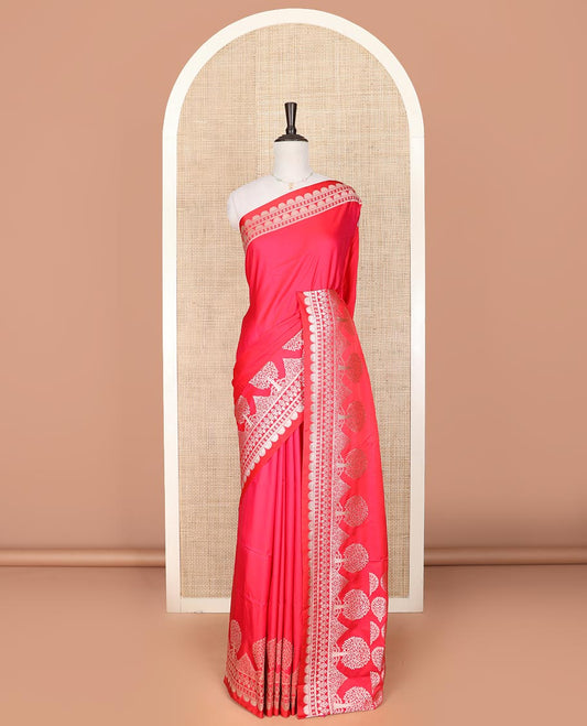 Pink plain mushru silk saree, self-border of scallop design, floral, and tree motifs, and intricately designed pallu