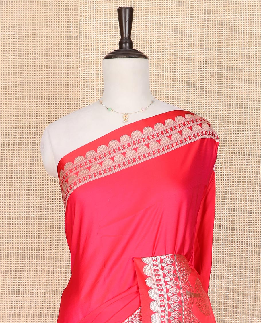Pink plain mushru silk saree, self-border of scallop design, floral, and tree motifs, and intricately designed pallu