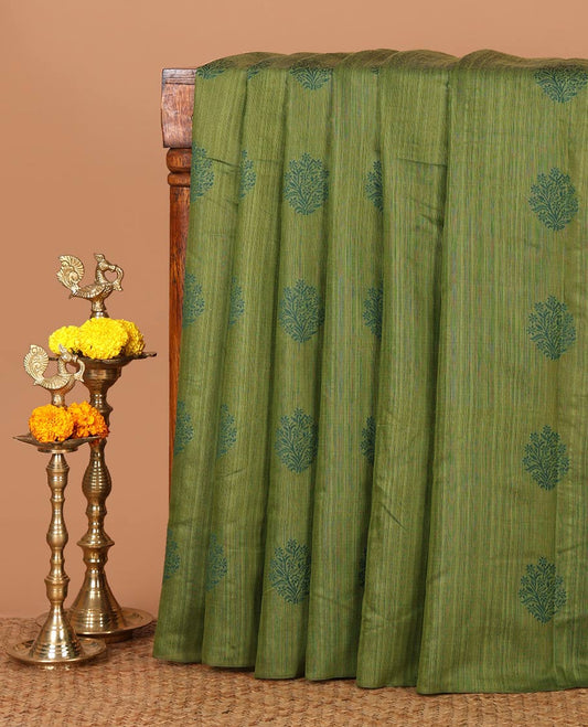 Borderless olive green banaras jute silk saree with floral thread buttas woven all over it's body, intricate pallu & butta design blouse