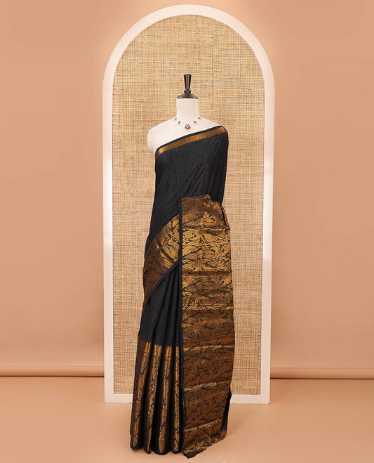 Dark green plain sungudi cotton saree, temple border of floral & bird zari designs, zari striped pallu & contrast orange jacquard blouse