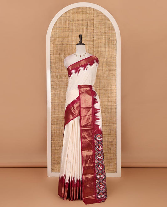 Cream-wine plain dola-tussar saree, contrast temple zari border, patola animal motifs enclosed jaal printed pallu & patola printed blouse