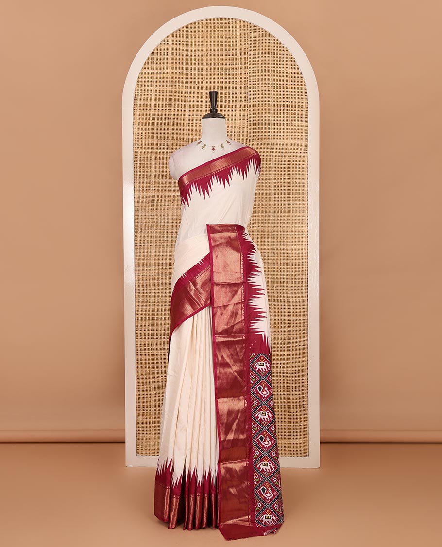 Cream-wine plain dola-tussar saree, contrast temple zari border, patola animal motifs enclosed jaal printed pallu & patola printed blouse