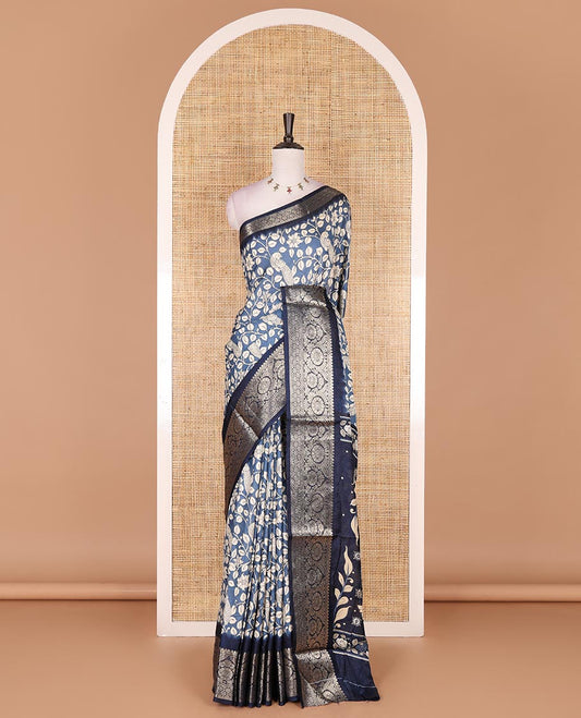 Blue kalamkari floral vine and peacock printed dola silk saree, contrast traditional zari border, peacock printed pallu, and floral vine print blouse