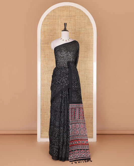 Borderless black bandhani style floral, paisley, and chakra printed semi-jute silk saree, contrast ajrakh printed pallu, and ajrakh printed blouse