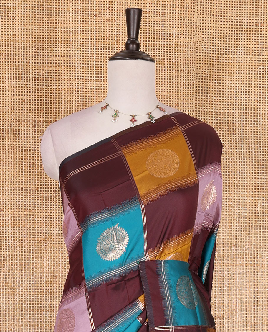 Borderless wine chakra buttas enclosed, checked elite soft silk saree, contrast ogee patterned pallu, and contrast zari design blouse