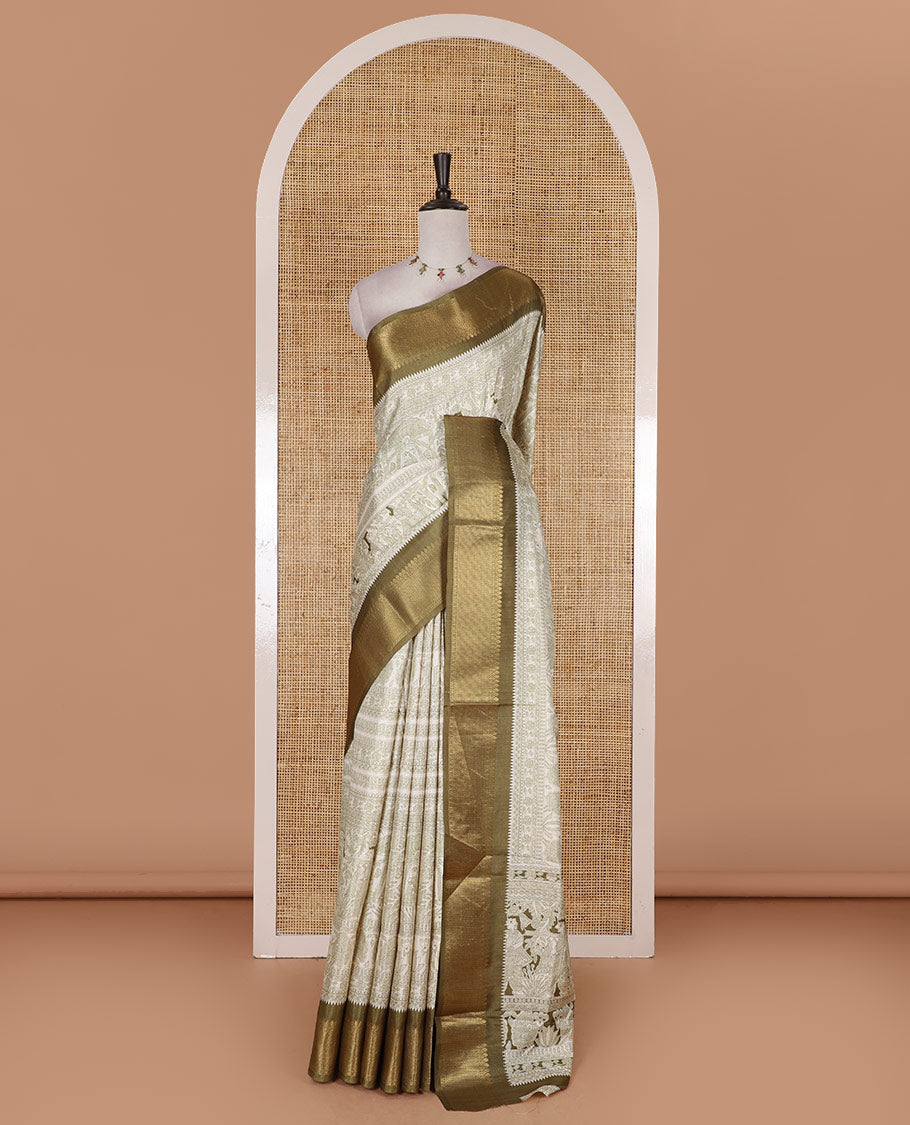 Cream and green Madhubani village theme characters printed soft tussar saree, contrast traditional zari border, Madhubani printed pallu, and a matching blouse