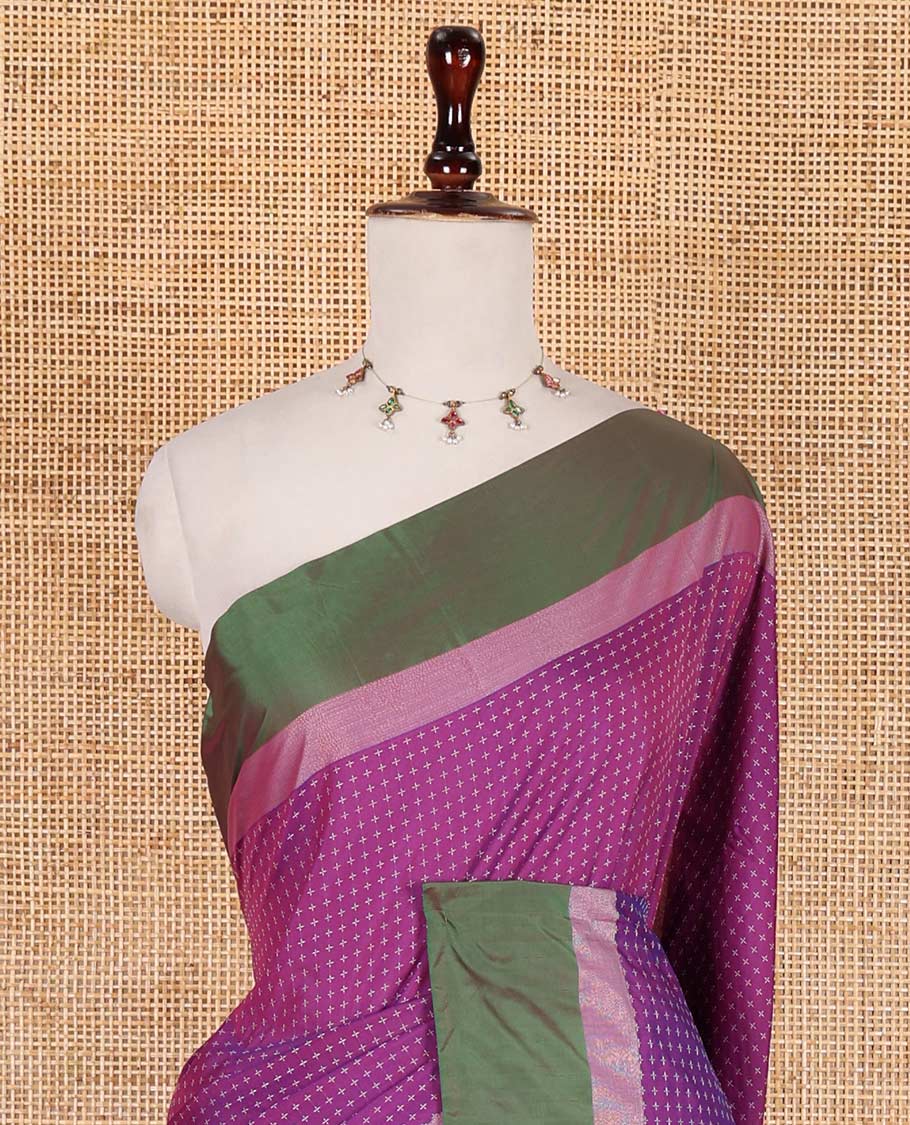 Purple-mehendi green plus-shaped buttas steeped semi-soft silk saree, contrast satin border of stripes, striped pallu, and contrast blouse