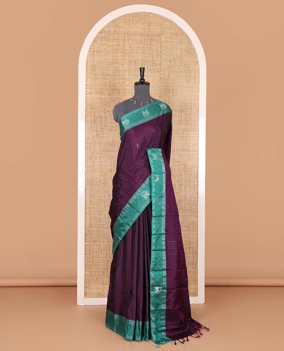 Purple zari buttas Kanchi silk saree, contrast yaali motifs zari green border, zari design pallu, and a matching blouse