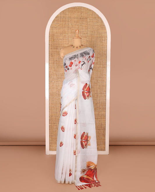 White Christmas-theme digital printed Chanderi cotton saree features bell motifs, piping zari border, big bell printed pallu, and blouse of tiny bell motifs print