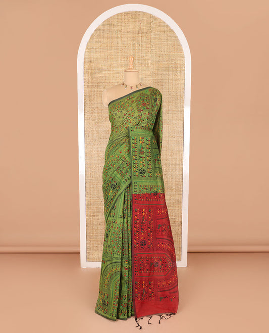 Borderless olive green and red Warli village printed khadi mul cotton saree, contrast Warli motifs printed pallu, and a plain blouse