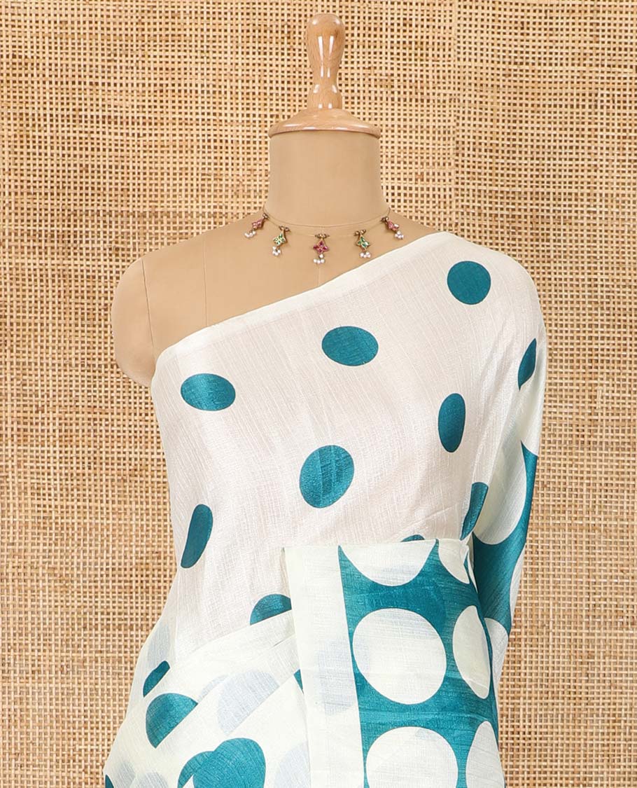 Borderless cream and blue polka dots printed art khadi cotton saree, pallu steeped with polka dots, and a contrast tiny polka dots printed blouse