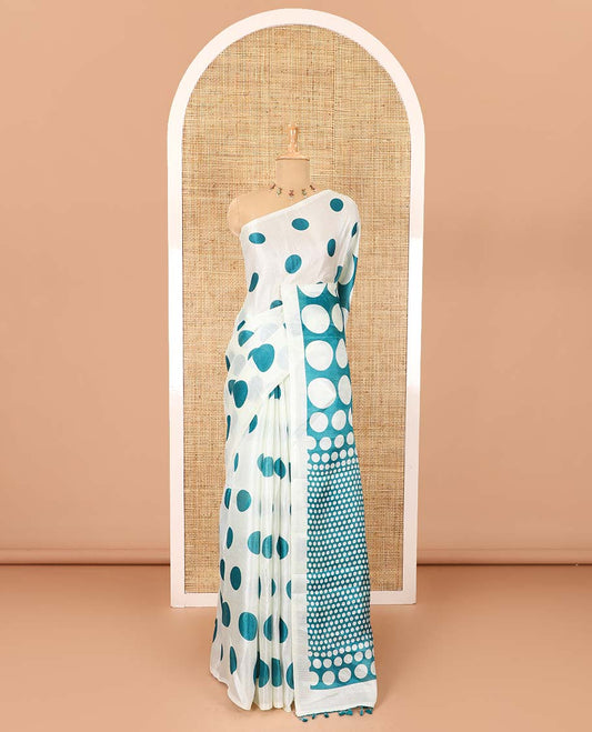 Borderless cream and blue polka dots printed art khadi cotton saree, pallu steeped with polka dots, and a contrast tiny polka dots printed blouse