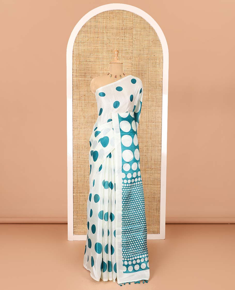 Borderless cream and blue polka dots printed art khadi cotton saree, pallu steeped with polka dots, and a contrast tiny polka dots printed blouse