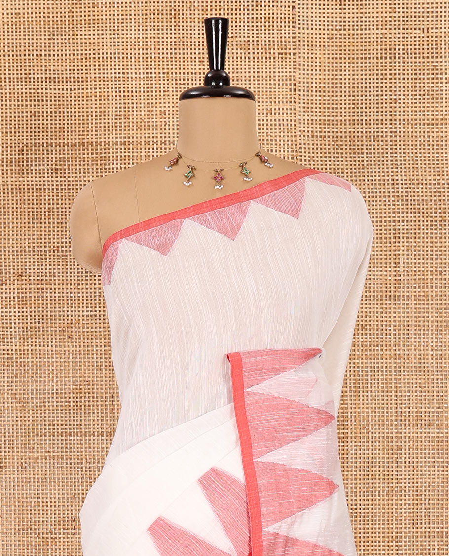 Half-white and red plain khadi mul cotton saree, contrast thread temple border, plain pallu, and a contrast plain blouse