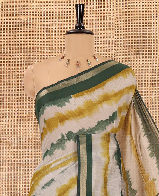Green shibori printed muslin cotton saree, contrast zari border, village theme printed pallu, and a contrast dots printed blouse