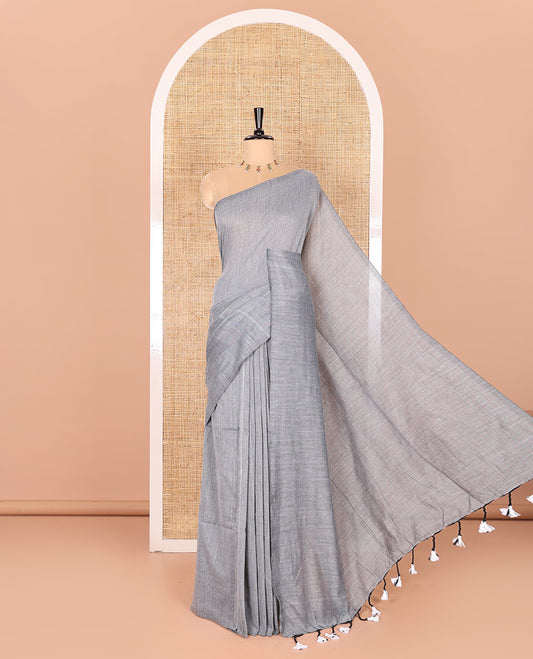 Borderless Grey Plain Khadi Mul Cotton Saree Featuring a Self Pallu with Tassels, Paired with a Matching Plain Blouse