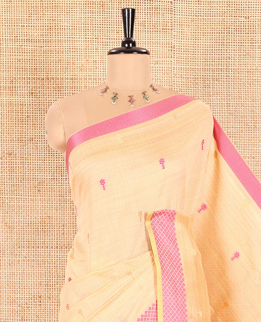Chikku Slub Cotton Saree Prettified with Resham Thread Buttas All Over Its Body, Subtly Woven Thread Border of Diamond Design, Captivating Contrasting Thread Work Pallu, and a Contrast Blouse