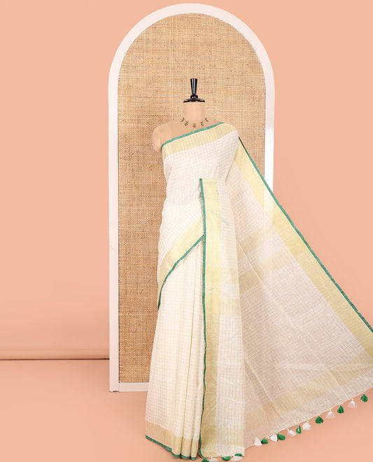Cream and Green Linen Saree Sparsely Sparkled with Checks, Subtly Designed Zari Border, Zari Striped Pallu, and Paired with a Contrast Blouse