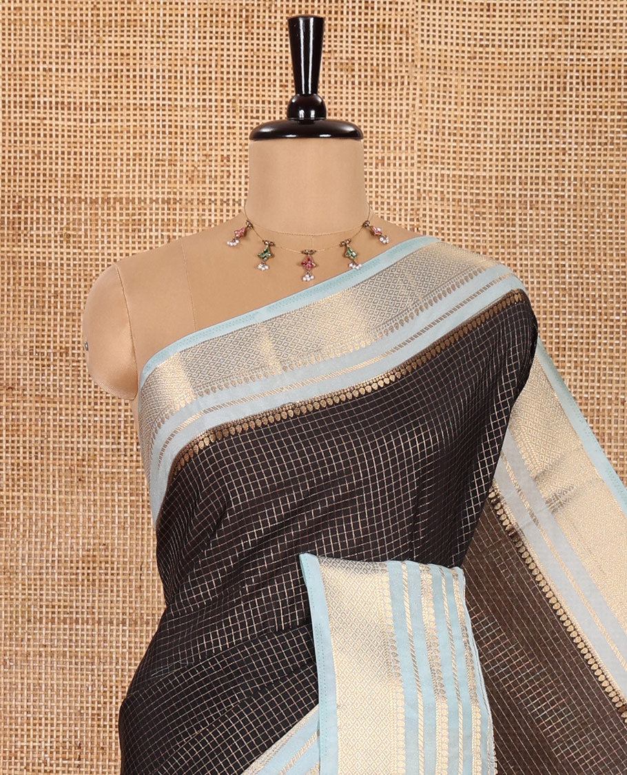 Black and Blue Semi-Mysore Crepe Saree Gleamed Up with Micro-Checks, Complemented by Contrast Traditional Zari Design Border, Gracefully Embellished Pallu of Thilakam Designs, and Paired with a Contrast Blouse