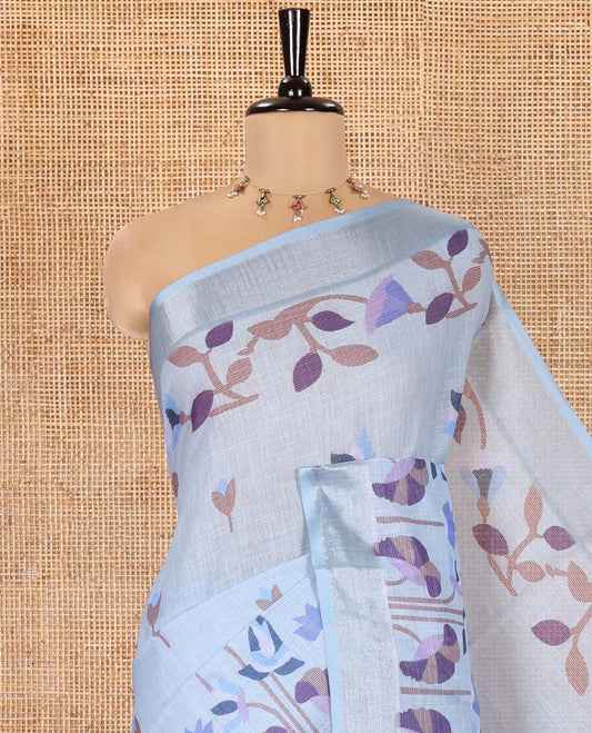 Sea Blue Linen Cotton Saree, Elevated with Jamdani-Style Lotus Designs Printed All Over Its Body, Zari Tissue Border, Pallu Mirrors the Same Print, and Paired with a Matching Blouse