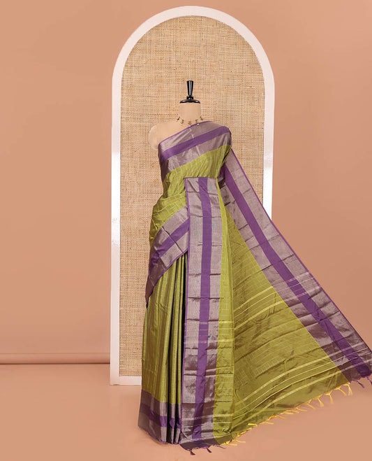Green Soft Silk Saree, Ornamented with Checked Design on Its Body, Complemented by Contrast Rettai Pettu Border, Subtly Striped Pallu, and Paired with a Matching Blouse