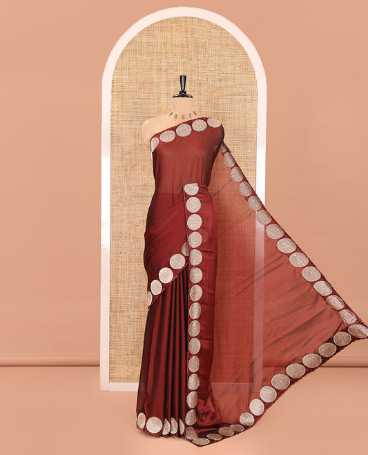 Brown Plain Black Rangoli Saree, Scallop Border Spotlighted by Round Motifs, Patch Embroidery, Self-Pallu, and Paired with a Matching Blouse