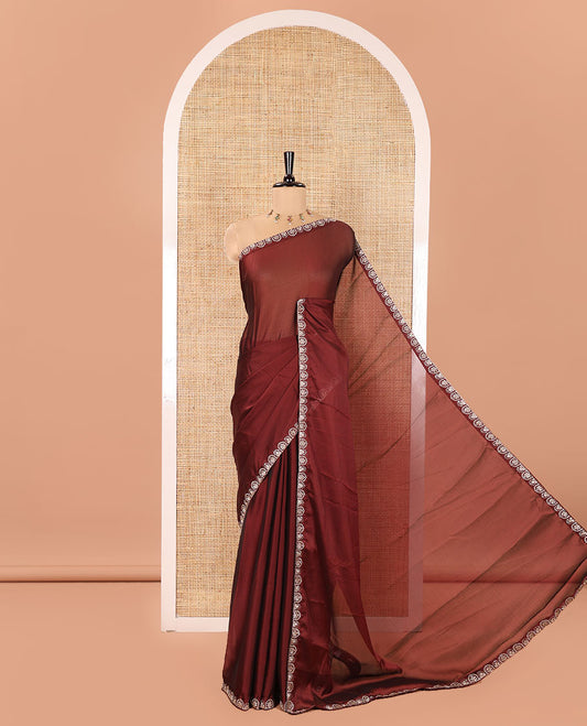Maroon Plain Rangoli Chiffon Saree, Ornamented with Piping Embroidered Border, Self-Pallu, and Paired with a Matching Embroidered Blouse