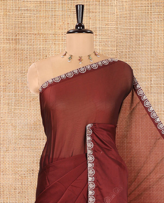 Maroon Plain Rangoli Chiffon Saree, Ornamented with Piping Embroidered Border, Self-Pallu, and Paired with a Matching Embroidered Blouse