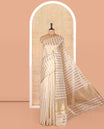 Borderless Off-white Tissue Saree, Entralled with Thick Vertical Golden Zari Stripes All Over Its Body, Highlighted by Gleaming Zari Striped Pallu, and Paired with a Matching Blouse