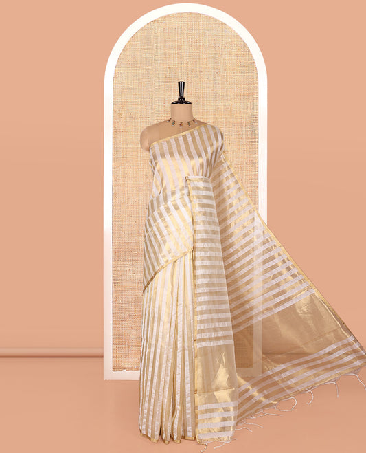 Borderless Off-white Tissue Saree, Entralled with Thick Vertical Golden Zari Stripes All Over Its Body, Highlighted by Gleaming Zari Striped Pallu, and Paired with a Matching Blouse