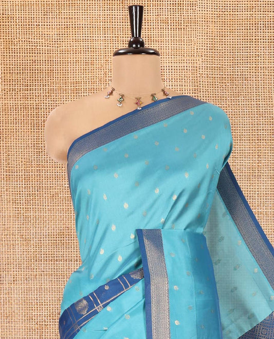 Blue and Navy Blue Kanchi Silk Saree, Subtly Enriched with Zari Buttas and Buttas Enclosed Checks On Its Body, Complemented by Zari Border, Jaal Pallu, and Paired with a Contrast Jacquard Blouse