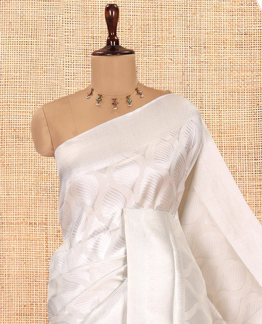 Off-white Elite Soft Silk Saree, Subtly Sparkled with Ogee Jacquard Design, a Traditional Zari Border, Zari Pallu, and a Matching Blouse
