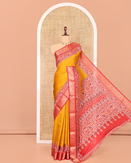 Mustard Embossed Moss Chiffon Saree, Complemented by a Contrast Traditional Zari Patola Printed Border, Patola Pallu, and a Contrast Blouse