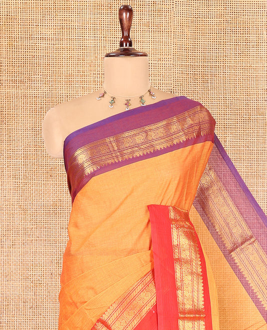 Mustard Plain Chettinad Cotton Saree, a Contrast Kal Eragina Traditional Ganga-Jamuna Border, Striped Pallu, and a Matching Blouse