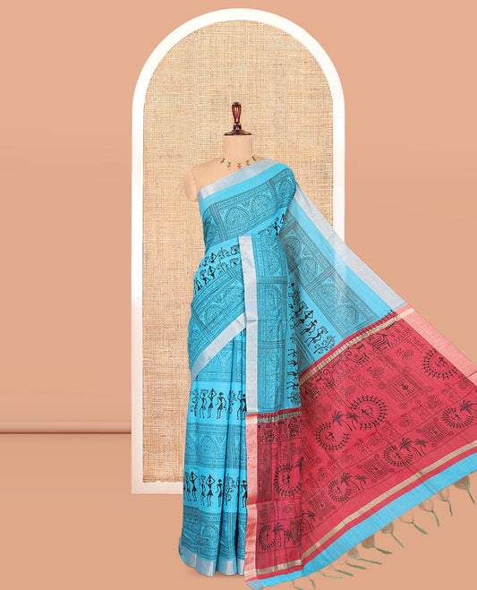 Sky Blue Semi-Silk Cotton Saree, Adorned with Warli Print, a Tissue Border, Contrast Warli Printed Pallu, and a Contrast Blouse