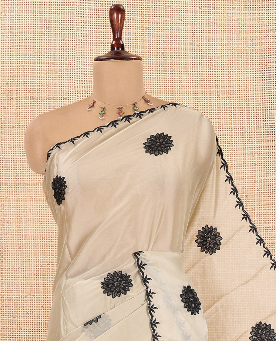 Chikku Chiffon Saree, Gracefully Embellished with Floral Embroidery Buttas, a Lace Embroidered Border, a Contrast Blouse