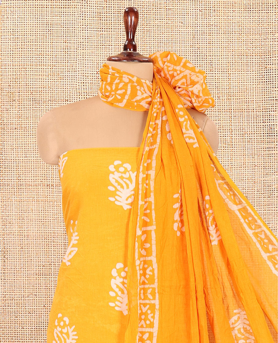 Yellow Cotton Material Chudidar, Batik Printed Top, a Matching Bottom, and Batik Print Dupatta
