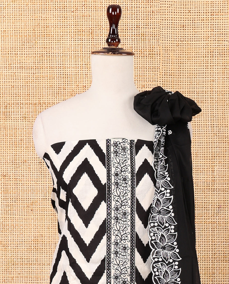 White & black cotton chudidar material set, zig-zag print & neck embroidery top, plain bottom & floral embroidered dupatta