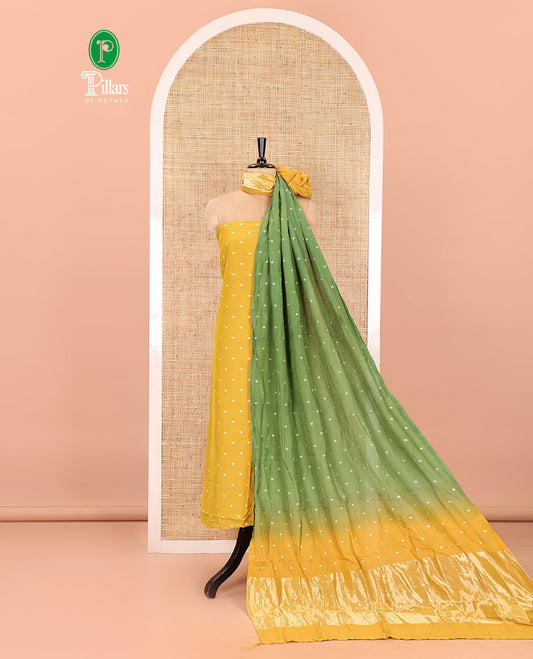 Yellow and Green Semi-Silk Material Churidar Set, Enthralled with Bandhani Dots Print, Comes with a Plain Santoon Bottom, and Paired with a Double-Colored Dupatta of Bandhani Dots Print