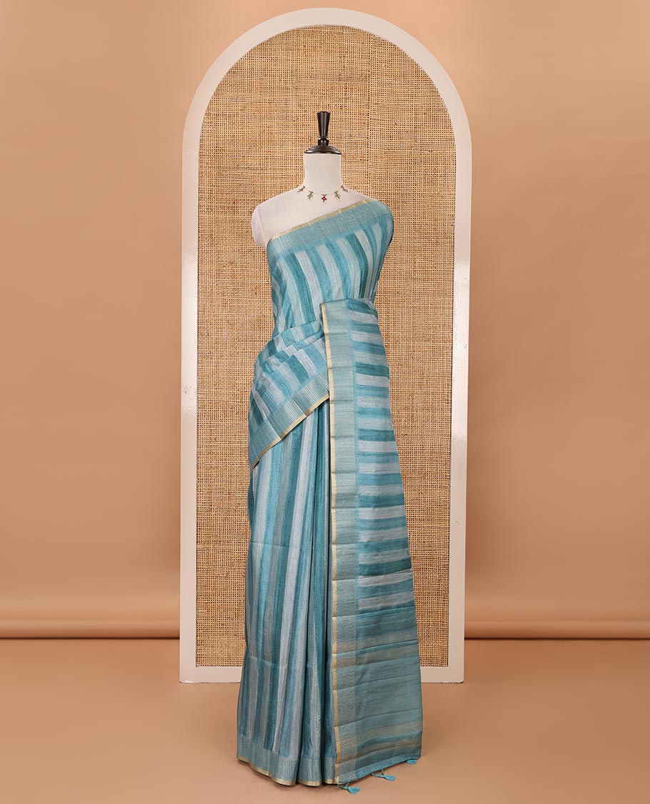 Rama blue hand brushing-style vertical stripes printed fancy tussar silk saree, zig zag-style zari woven border, zari pallu & striped blouse
