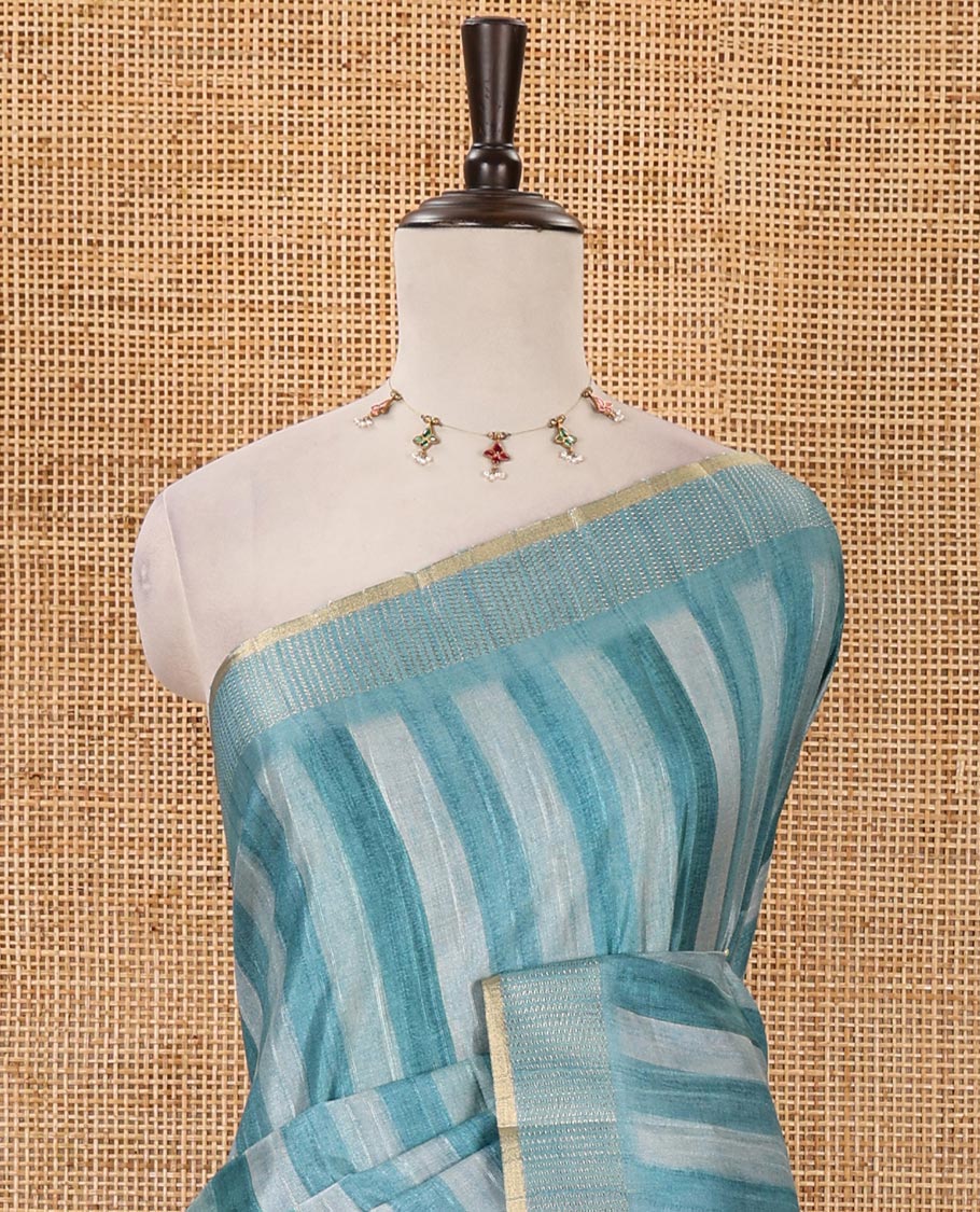 Rama blue hand brushing-style vertical stripes printed fancy tussar silk saree, zig zag-style zari woven border, zari pallu & striped blouse