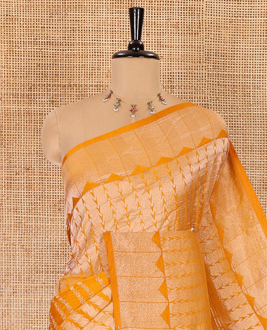 Mustard zari geometric fancy crepe saree, temple zari border, zari striped pallu, and a matching buttas woven blouse