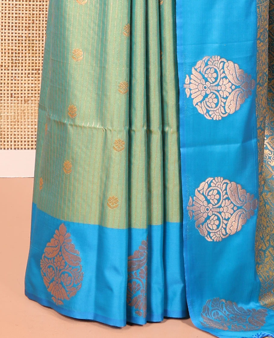 Green Fancy Soft Silk Saree, Accentuated with Zari Buttas and Zari Stripes, Complemented by a Contrast Border of Zari Designs, Intricately Designed Pallu, and Paired with a Contrast Blouse