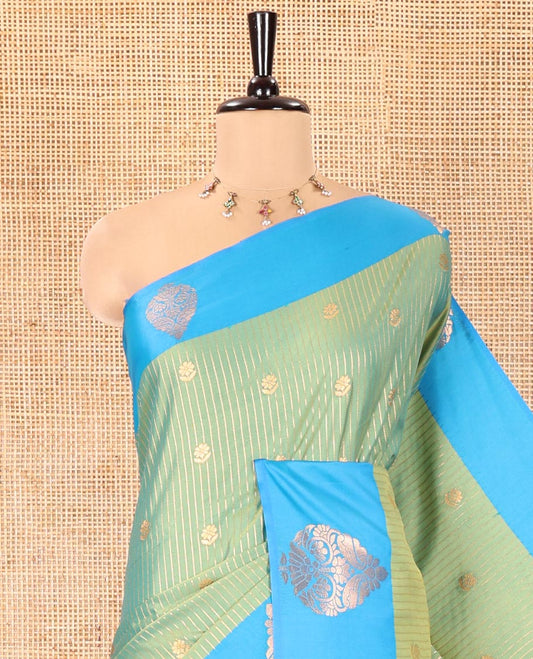 Green Fancy Soft Silk Saree, Accentuated with Zari Buttas and Zari Stripes, Complemented by a Contrast Border of Zari Designs, Intricately Designed Pallu, and Paired with a Contrast Blouse