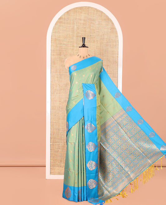 Green Fancy Soft Silk Saree, Accentuated with Zari Buttas and Zari Stripes, Complemented by a Contrast Border of Zari Designs, Intricately Designed Pallu, and Paired with a Contrast Blouse