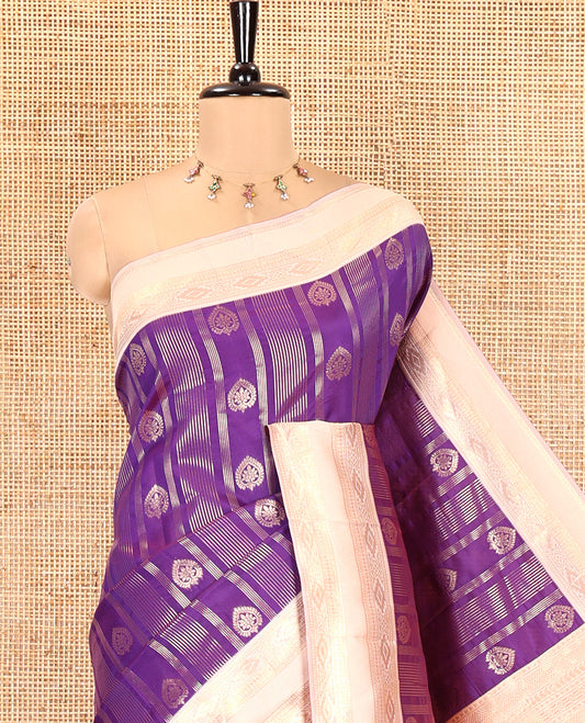 Magenta Pink Litchi Saree, Adorned with Vaira Oosi Stripes and Zari Buttas on Its Body, Complemented by a Contrast Rettai Pettu Traditional Zari Design Border, an Intricately Designed Pallu, and Paired with a Contrast Blouse
